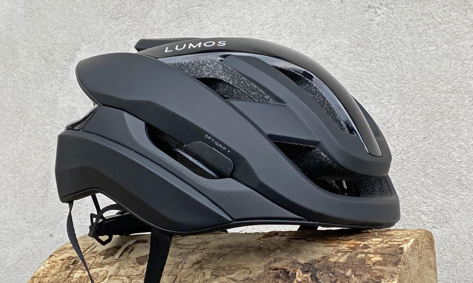 Lumos Ultra Fly Pro MIPS performance road helmet with built-in Firefly taillight, side