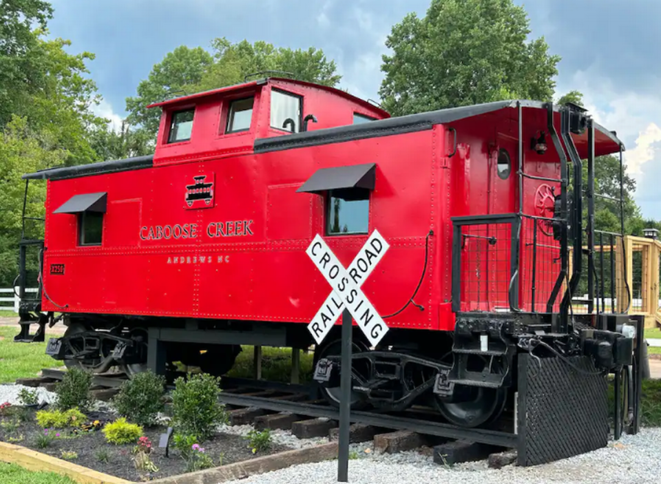 The 1933 Little Red Caboose on River Airbnb rental is located in Andrews, North Carolina.