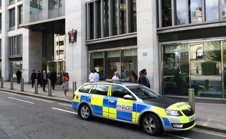 A police car is parked outside the London Stock Exchange in London, Britain August 15, 2017. REUTERS/Neil Hall