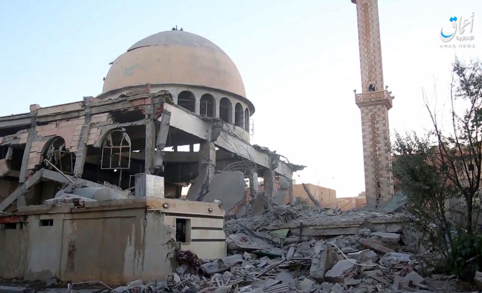 <p>This undated frame grab from video posted online Saturday, June 10, 2017, by the Aamaq News Agency, a media arm of the Islamic State group, shows a mosque that was damaged by bombardment by the U.S.-led coalition and U.S.-backed fighters in the northern Syrian city of Raqqa. A U.S.-backed Syrian opposition force says it has captured a northwestern neighborhood in the northern city of Raqqa from the Islamic State group after two days of fighting. (Photo: Aamaq News Agency via AP) </p>