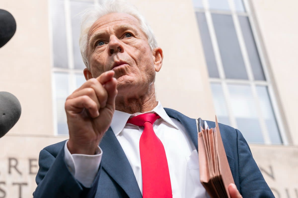 Former Trump White House official Peter Navarro speaks to reporters outside a federal court in Washington (AP)