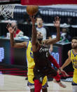 Portland Trail Blazers guard Damian Lillard scores against the Golden State Warriors during the second half of an NBA basketball game in Portland, Ore., Wednesday, March 3, 2021. (AP Photo/Craig Mitchelldyer)