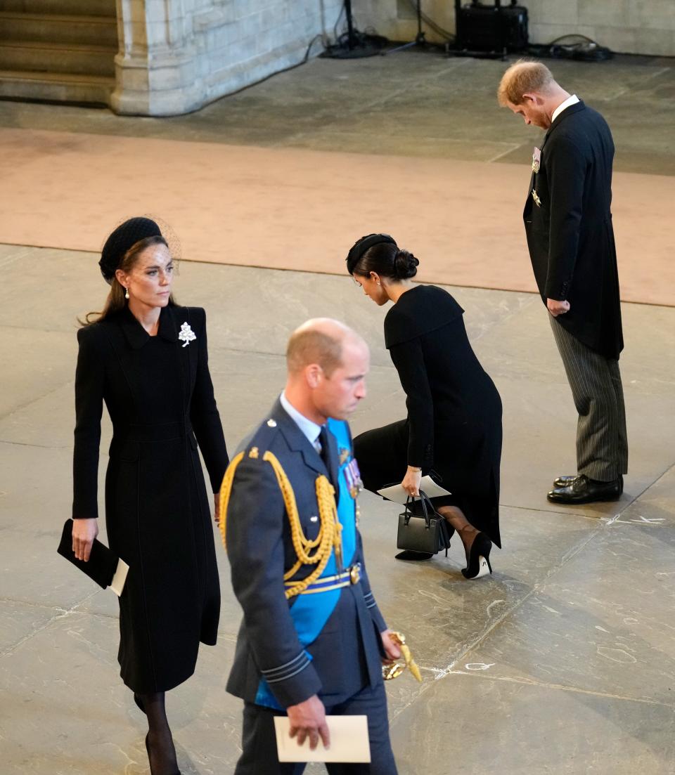 Meghan Markle curtsies in front of Queen Elizabeth's coffin at Westminster Hall on September 14.