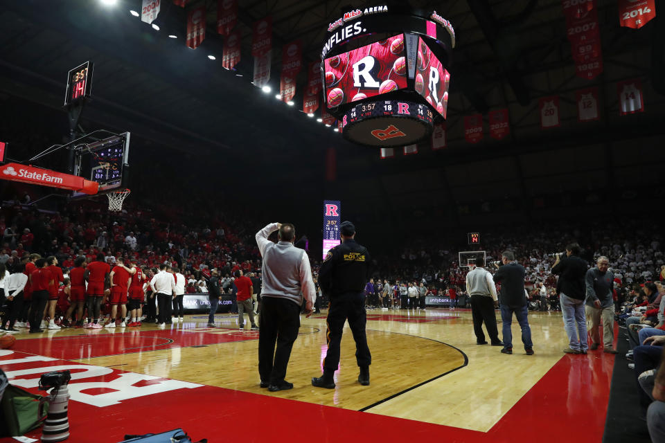 The basketball game between Rutgers and Northwestern was temporarily stopped because of a speaker fire in the scoreboard during the first half of an NCAA college basketball game, Sunday, Mar.5, 2023 in Piscataway, N.J. (AP Photo/Noah K. Murray)