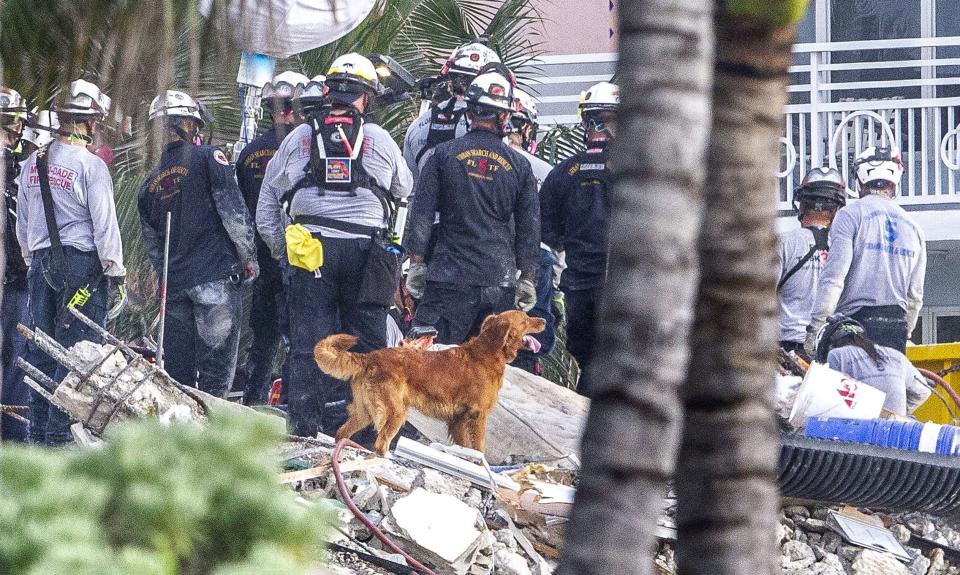 Search and rescue teams look for survivors at the 12-story oceanfront condo, Champlain Towers South, on Wednesday, June 30, 2021, in Surfside, Fla., seven days after the building collapsed. (Pedro Portal/Miami Herald via AP)