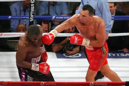 Apr 25, 2015; New York, NY, USA; Wladimir Klitschko (red trunks) boxes against Bryant Jennings (black trunks) during the twelfth round of their world championship heavyweight boxing fight at Madison Square Garden. Mandatory Credit: Brad Penner-USA TODAY Sports