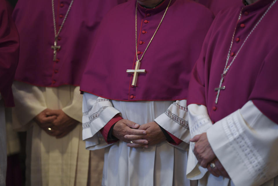 Bishops attend the opening mass of the German bishops' conference in Fulda, Germany, Tuesday, Sept. 25, 2018 where the bishops will discuss a study on sexual abuse in the Catholic church in Germany. (Arne Dedert/dpa via AP)