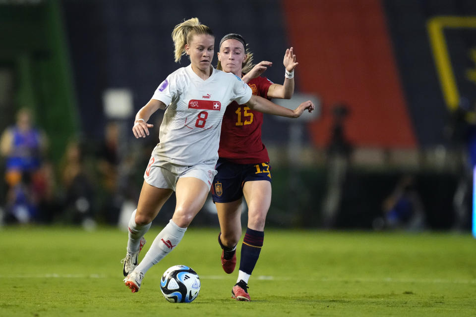 Switzerland's Nadine Riesen, left, and Spain's Eva Navarro fight for the ball during the women's Nations League group D soccer match between Spain and Switzerland at the Nuevo Arcangel stadium in Cordoba, Spain, Tuesday, Sept. 26, 2023. (AP Photo/Jose Breton)