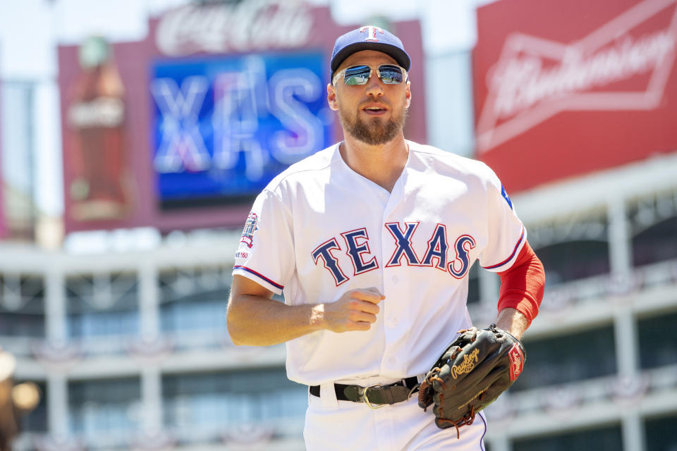 Texas Rangers' Hunter Pence runs to the dugout before the first baseball game of a doubleheader against the Oakland Athletics Saturday, June 8, 2019, in Arlington, Texas. Texas won 10-5. (AP Photo/Jeffrey McWhorter)