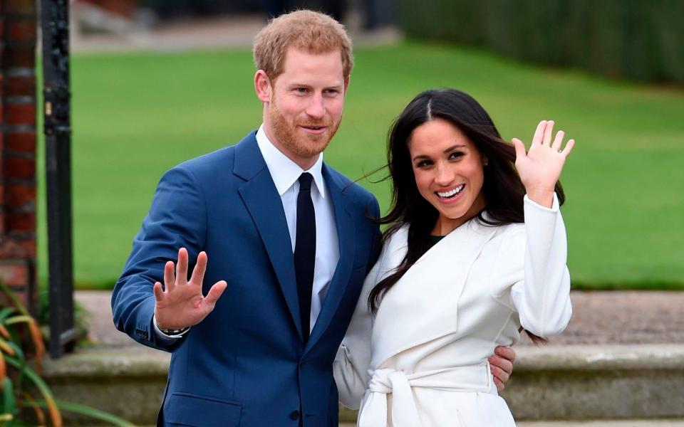 Prince Harry and Meghan Markle pose for the press after announcing their engagement in November 2017 [Photo: Getty]