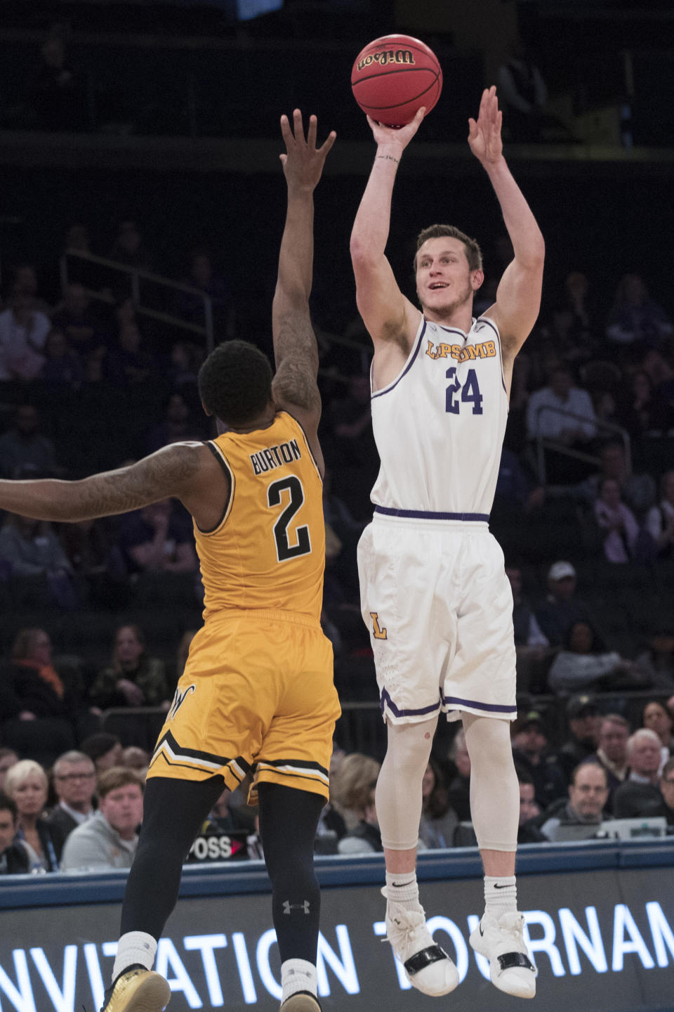 Lipscomb guard Garrison Mathews (24) shoots a 3-point goal past Wichita State guard Jamarius Burton (2) during the first half of a semifinal college basketball game in the National Invitational Tournament, Tuesday, April 2, 2019, at Madison Square Garden in New York. (AP Photo/Mary Altaffer)