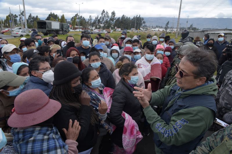 Family members of inmates wait for information on their loved ones, after a riot at the penitentiary Cotopaxi No 1, in Latacunga