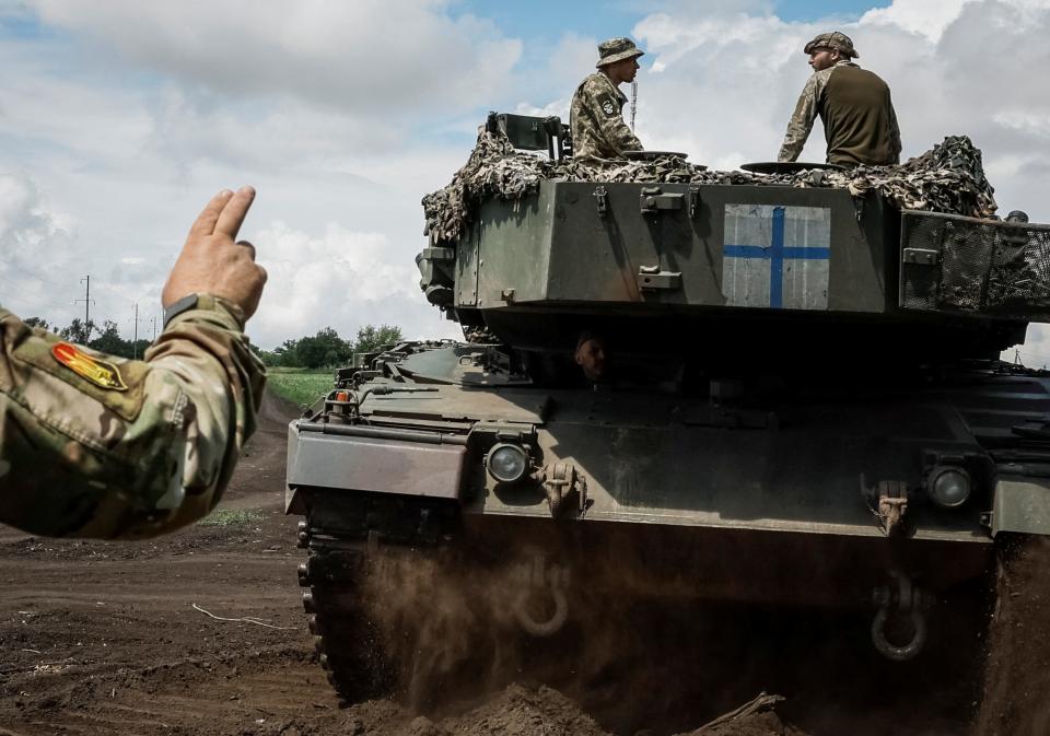 Ukrainian service members of the 33rd Separate Mechanized Brigade ride a German-made Leopard tank during a test drive at an undisclosed location in the east of Ukraine on July 16.