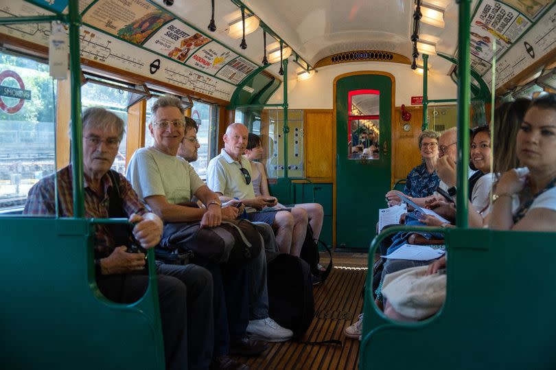 People ride on a 1938 Art Deco-style London underground train