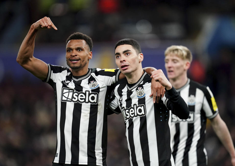 Newcastle United's Jacob Murphy, left, Miguel Almiron celebrate their third goal of the game during their English Premier League soccer match at Villa Park, Birmingham, England, Tuesday, Jan. 30, 2024. (Jacob King/PA via AP)