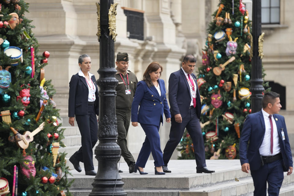 Peru's new President Dina Boluarte arrives to make a statement at the government palace in Lima, Peru, Thursday, Dec. 8, 2022. Peru's Congress voted to remove President Pedro Castillo from office Wednesday and replace him with the vice president, Boluarte, shortly after Castillo tried to dissolve the legislature ahead of a scheduled vote to remove him. (AP Photo/Fernando Vergara)