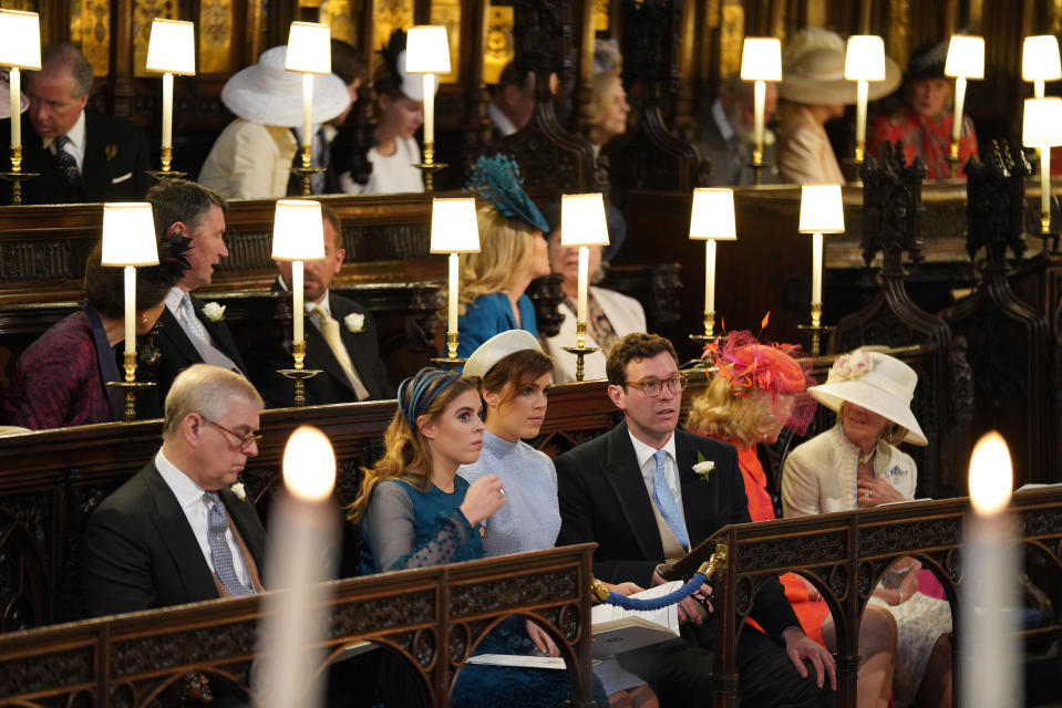 Prince Andrew, Duke of York, Princess Beatrice, Princess Eugenie and Jack Brooksbank sit in St George's Chapel at Windsor Castle ahead of the wedding of Prince Harry and Meghan Markle  on May 19, 2018 in Windsor, England.