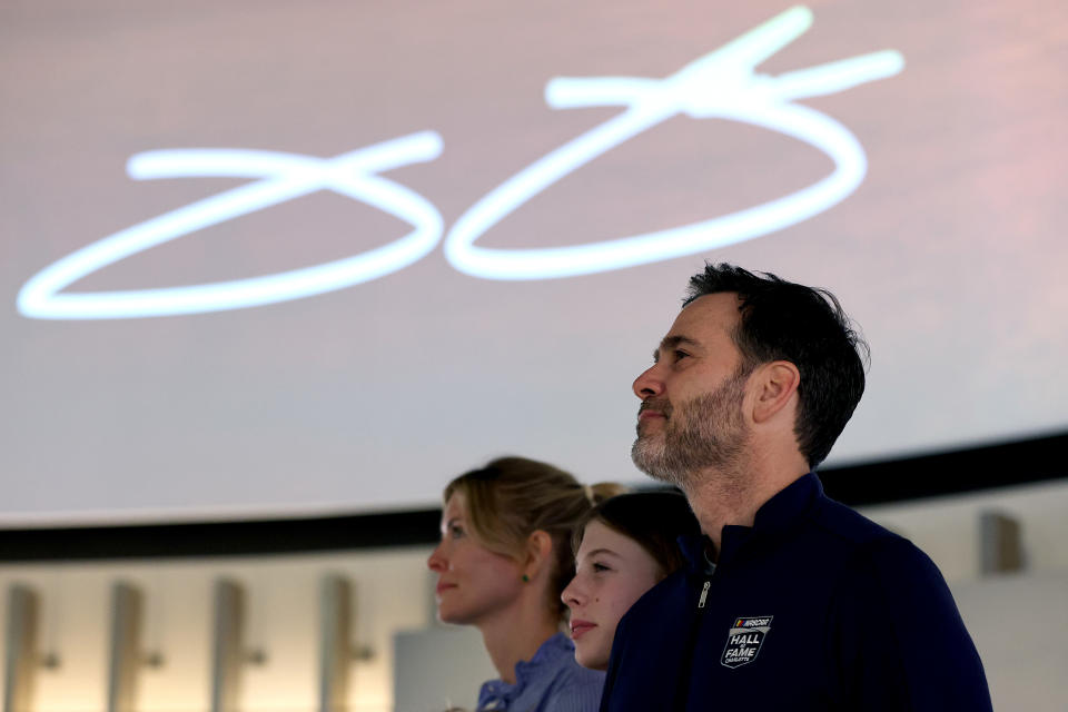 CHARLOTTE, NORTH CAROLINA - JANUARY 20: NASCAR Hall of Fame inductee Jimmie Johnson, daughter Genevieve Johnson, and wife, Chandra Johnson view his Hall of Honor exhibition at NASCAR Hall of Fame on January 20, 2024 in Charlotte, North Carolina. (Photo by David Jensen/Getty Images)