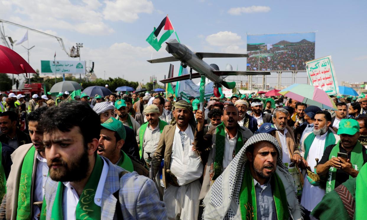 <span>A Houthi supporter holds up a mock drone during a rally in Sana’a on Sunday to mark the anniversary of the birth of the prophet Mohammad and to show solidarity with Palestinians in Gaza.</span><span>Photograph: Khaled Abdullah/Reuters</span>