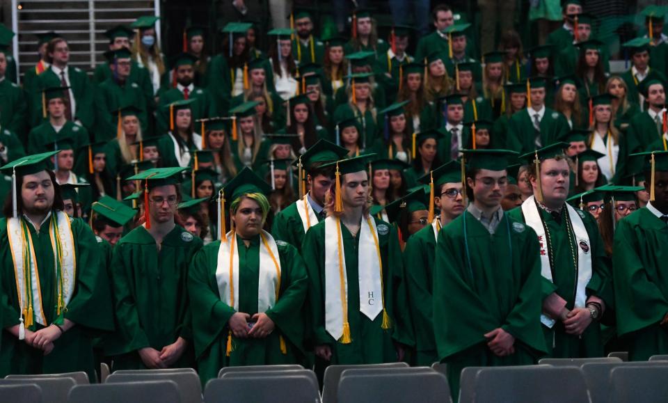 Members of the Class of 2023 have a moment of silence honoring the three MSU students killed in the February campus shooting Friday, May 5, 2023, during the Michigan State University 2023 Spring Commencement at the Breslin Center in East Lansing.