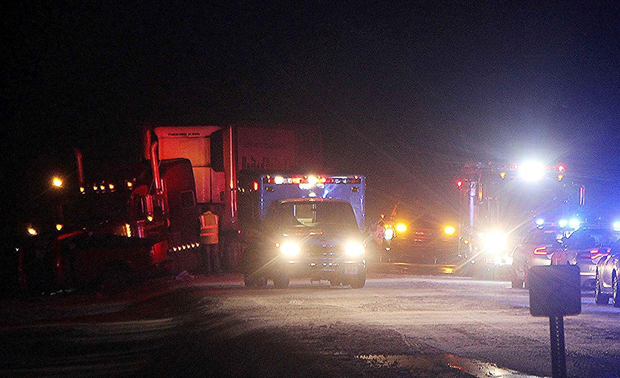 Emergency crews from New Pittsburg Fire and Rescue and the State Highway Patrol work the scene of a fatal crash Friday night that closed a section of U.S. Route 250 in both directions east of North Elyria Road.