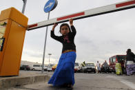 A member of Romania's ethnic Roma minority arrives at Bucharest airport August 9, 2012. Roma people arrived in Romania after French police raided a makeshift Roma camp, evicting about 200 people as the Socialist government quietly follows the former conservative administration's policy of repatriating illegal immigrants. The evacuation follows a series of police raids this week in Paris and Lyon during which hundreds of undocumented Roma immigrants from eastern Europe were forced from their homes. REUTERS/Bogdan Cristel (ROMANIA - Tags: SOCIETY IMMIGRATION POLITICS)