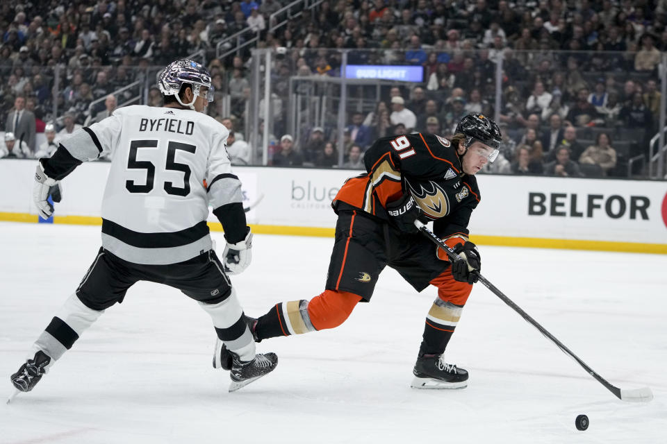 Anaheim Ducks center Leo Carlsson, right, skates against Los Angeles Kings right wing Quinton Byfield during the first period of an NHL hockey game Saturday, Feb. 24, 2024, in Los Angeles. (AP Photo/Ryan Sun)
