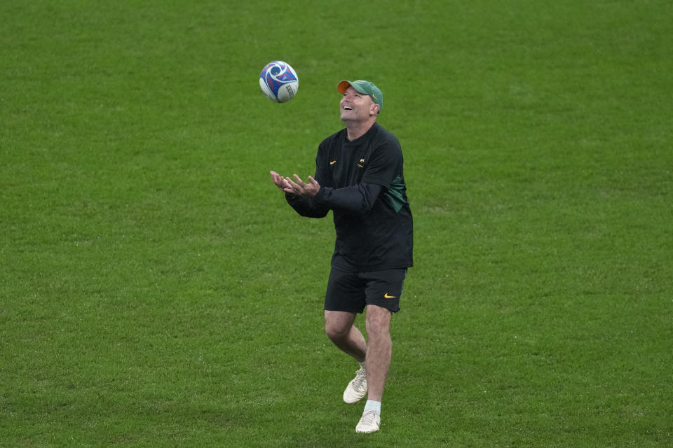 South Africa's head coach Jacques Nienaber catches a ball before the Rugby World Cup final match between New Zealand and South Africa at the Stade de France in Saint-Denis, near Paris Saturday, Oct. 28, 2023. (AP Photo/Themba Hadebe)