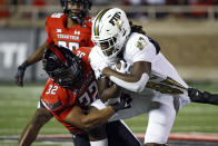 Texas Tech's Tyrique Matthews (32) tackles Florida International's Kamareon Williams (87) during the second half of an NCAA college football game on Saturday, Sept. 18, 2021, in Lubbock, Texas. (AP Photo/Brad Tollefson)