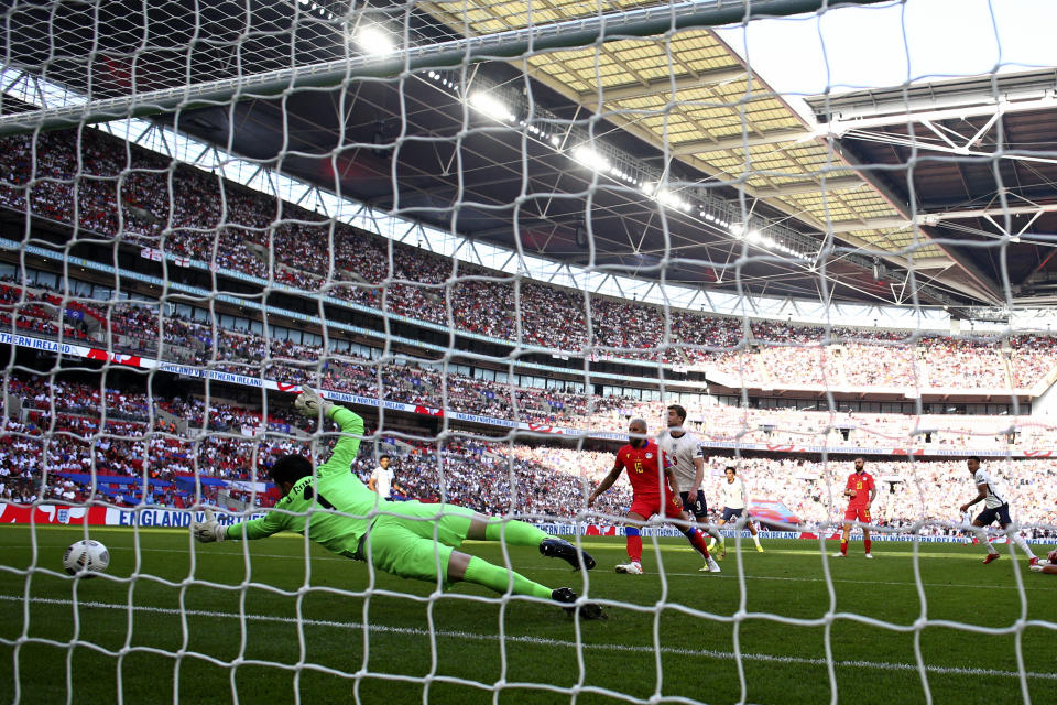 England's Jesse Lingard, right, scores the opening goal during the World Cup 2022 group I qualifying soccer match between England and Andorra at Wembley stadium in London, Sunday, Sept. 5, 2021. (AP Photo/Ian Walton)