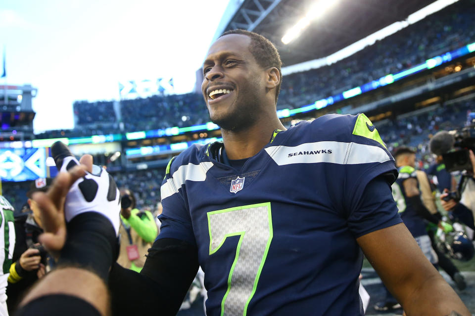 SEATTLE, WASHINGTON - JANUARY 01: Geno Smith #7 of the Seattle Seahawks on the field after a win over the New York Jets  at Lumen Field on January 01, 2023 in Seattle, Washington. (Photo by Lindsey Wasson/Getty Images)