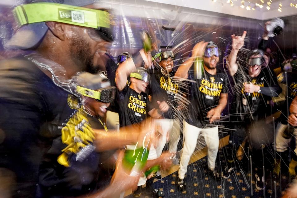 Milwaukee Brewers' players celebrate after clinching the National League Central Division after a baseball game against the St. Louis Cardinals Tuesday, Sept. 26, 2023, in Milwaukee. (AP Photo/Morry Gash)