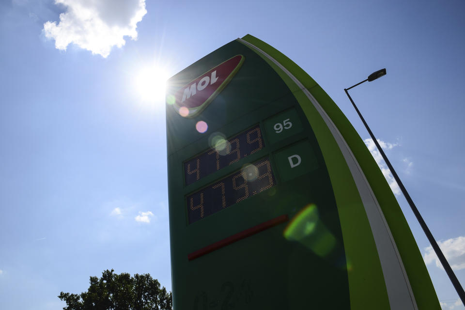 Discounted fuel prices are seen on a display of a petrol station, in Budapest, Hungary, Sunday, June 12, 2022. Hungary has placed price caps on fuel and some food and imposed special taxes on industries as the government tries to ease an economic downturn and the highest inflation in nearly 25 years. (AP Photo/Anna Szilagyi)