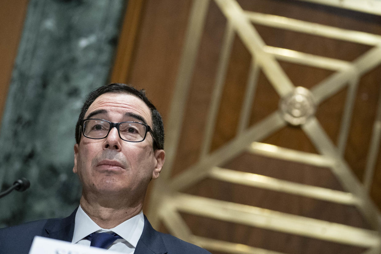 US Secretary of the Treasury Steven Mnuchin testifies during a hearing before the Congressional Oversight Commission on December 10, 2020 on Capitol Hill in Washington, DC. - The commission held a hearing on Examination of Loans to Businesses Critical to Maintaining National Security. (Photo by Sarah Silbiger / POOL / AFP) (Photo by SARAH SILBIGER/POOL/AFP via Getty Images)