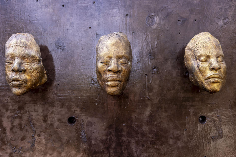 Detail from "108 Death Masks," by Nikesha Breeze, ceramic cast in bronze, 2018, during a media tour of Equal Justice Initiative's new Freedom Monument Sculpture Park, Tuesday, March 12, 2024, in Montgomery, Ala. (AP Photo/Vasha Hunt)