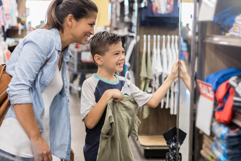 Woman with a child in a clothing store