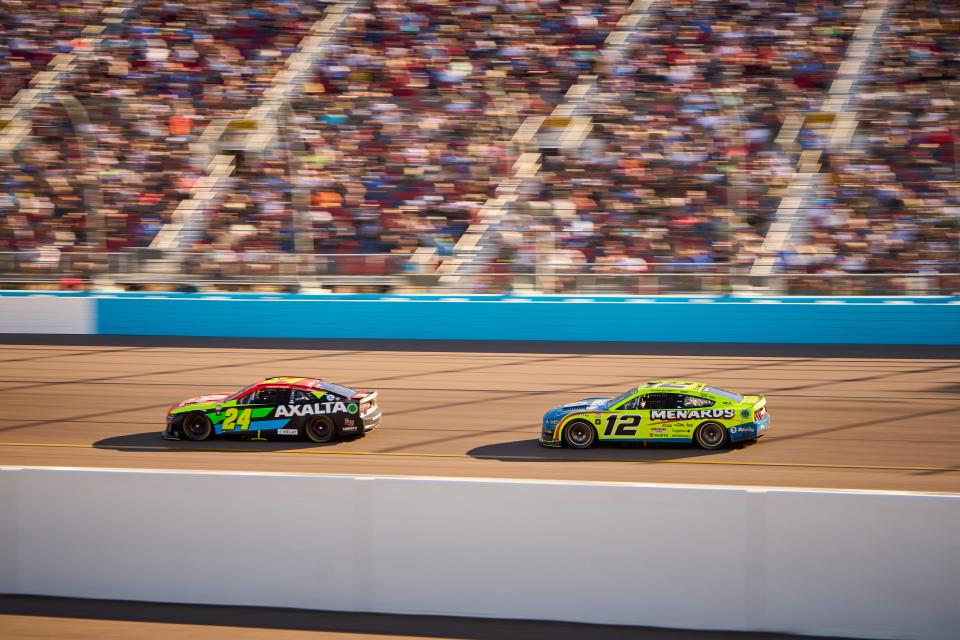 NASCAR Cup Series driver Ryan Blaney (12) chases William Byron (24) into the dogleg during the Cup Series Championship race at Phoenix Raceway in Avondale on Nov. 5, 2023.
