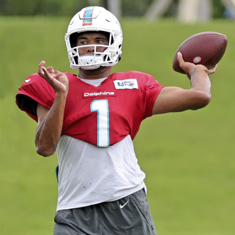 Miami Dolphins quarterback Tua Tagovailoa (1) sets up to pass during NFL football practice in Miami Gardens Fla., Wednesday, Oct. 13, 2021. The Dolphins play against the Jacksonville Jaguars in London on Sunday. (David Santiago(David Santiago/Miami Herald via AP)