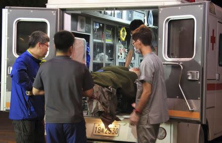 A wounded soldier is carried from an ambulance to a hospital in Gangneung June 22, 2014. REUTERS/Seo Geun-young/News1