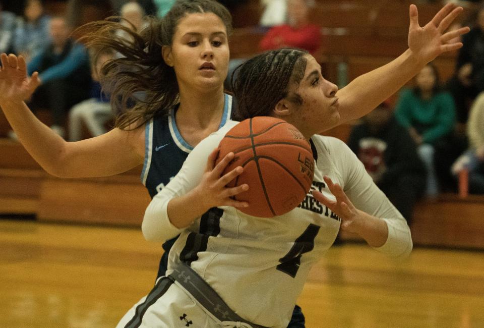 East Rochester's Zarriah Eldridge drives to the basket against Gananda's Eva Jenny.