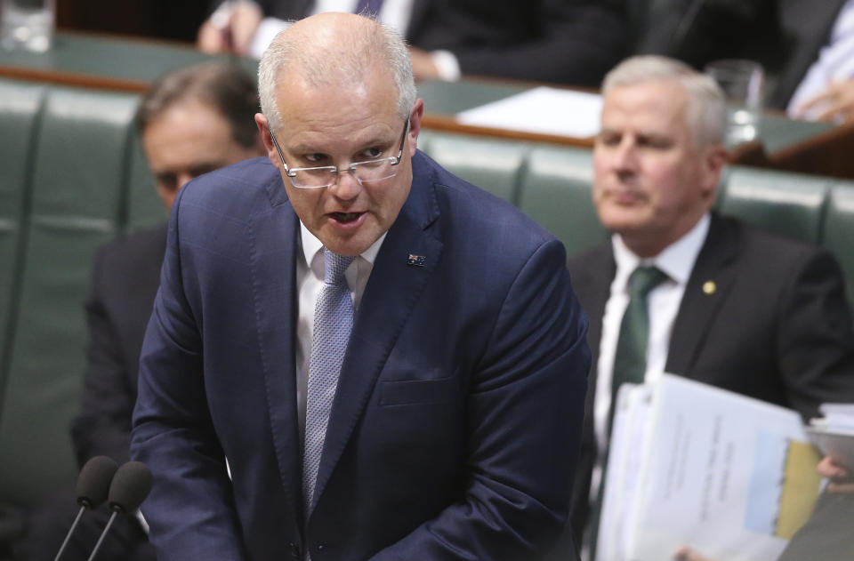 Australian Prime Minister Scott Morrison speaks in Parliament in Canberra, Australia, on Wednesday, Sept. 11, 2019. Morrison is standing by the first Chinese-born lawmaker to be elected to the national parliament who has come under attack over her links to the Chinese foreign influence network. (AP Photo/Rod McGuirk)