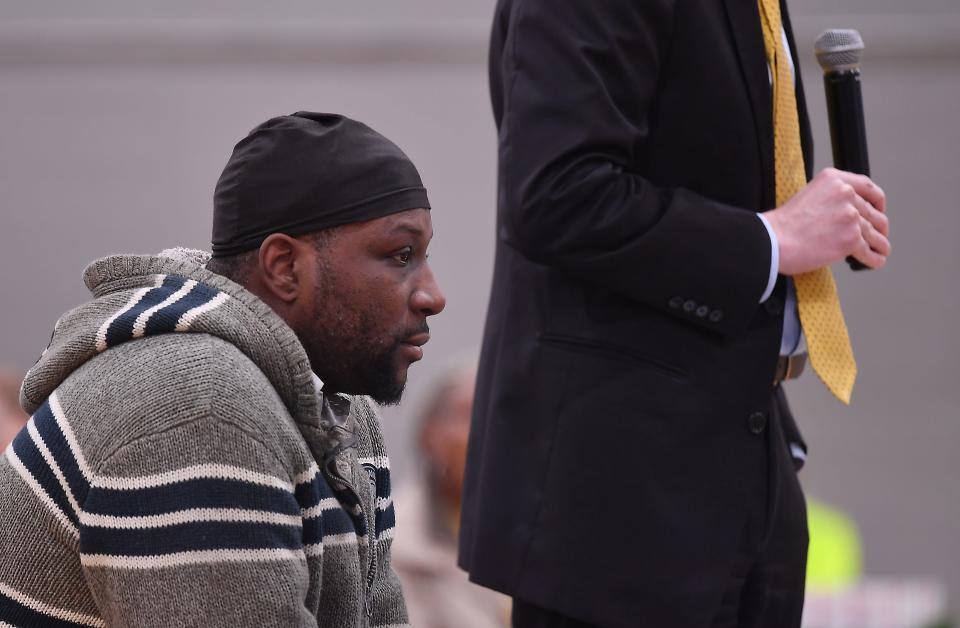 Ahmad Boneparte, left, listens as his case is heard at Homeless Court.