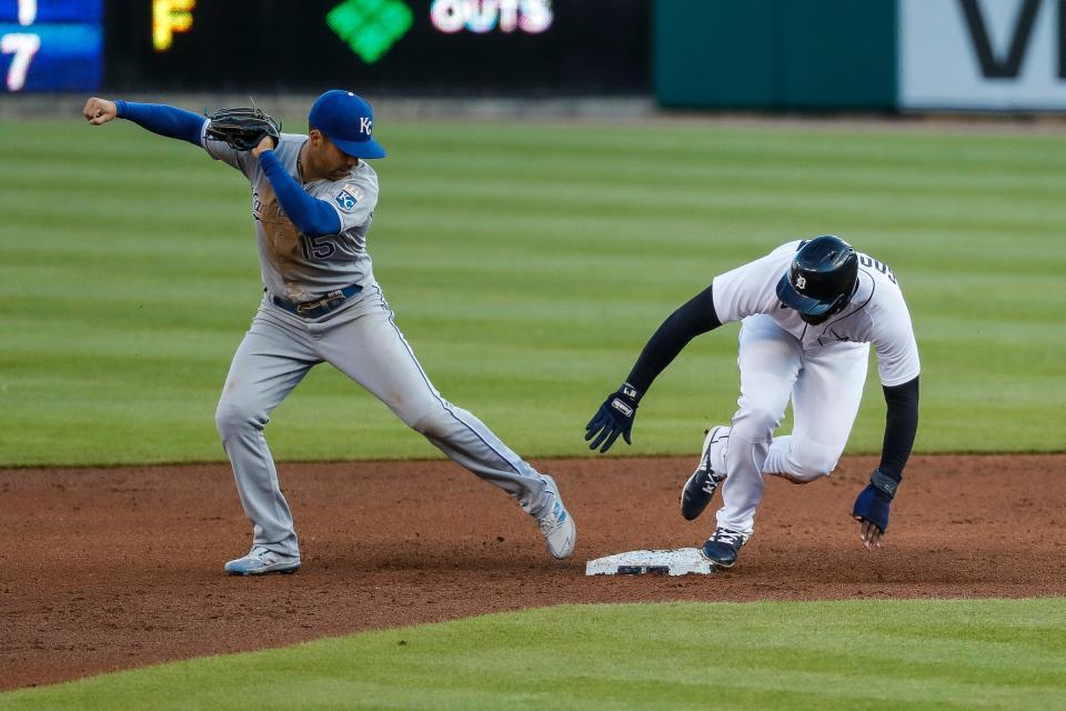 Detroit Tigers short stop Niko Goodrum (28) slides into second base against Kansas City Royals second baseman Whit Merrifield (15) during second inning at Comerica Park in Detroit on Wednesday, May 12, 2021.