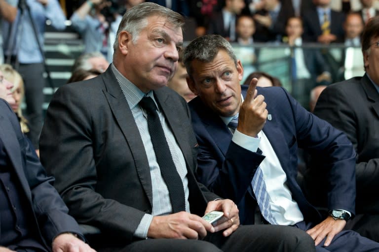 England football manager Sam Allardyce (L) and English Football Association (FA) chief executive Martin Glenn (R) sit in the audience ahead of an event to launch the logo for the 2020 UEFA European Championship football tournament