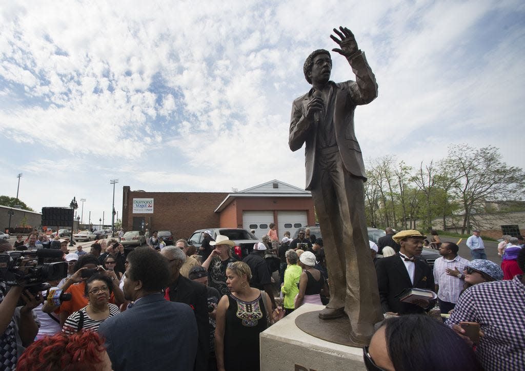 The Richard Pryor statue stands tall over the crowd at its unveiling on the corner of SW Washington Street and State Street.