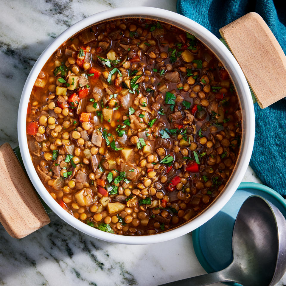 <p>Fresh and dried mushrooms provide a deep umami flavor in this brothy soup, while harissa paste brings color and spiciness. Lentils serve as a great source of plant-based protein and help bulk up the soup so you'll feel full and satisfied.</p> <p> <a href="https://www.eatingwell.com/recipe/8016082/mushroom-lentil-soup/" rel="nofollow noopener" target="_blank" data-ylk="slk:View Recipe" class="link ">View Recipe</a></p>