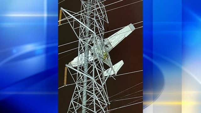 A plane was suspended 100 feet in the air after it crashed into power lines in Maryland.