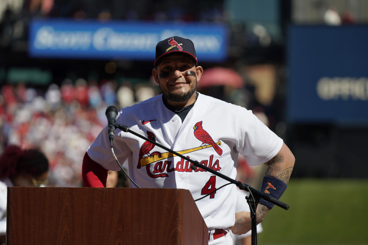 St. Louis Cardinals' Yadier Molina pauses while speaking as he and teammate Albert Pujols are honored during a ceremony before the start of the Cardinals' final regular season baseball game Sunday, Oct. 2, 2022, against the Pittsburgh Pirates in St. Louis. Pujols and Molina have said they plan to retire at the conclusion of this season. (AP Photo/Jeff Roberson)