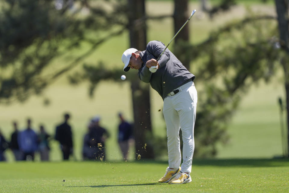 Brooks Koepka hits from the fairway on the first hole during the final round of the Masters golf tournament at Augusta National Golf Club on Sunday, April 9, 2023, in Augusta, Ga. (AP Photo/David J. Phillip)