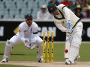 Australia's captain Michael Clarke (R) plays a shot next to England's vice-captain Matt Prior during the second day of the second Ashes test cricket match at the Adelaide Oval December 6, 2013.